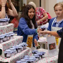 School children selling their produce on Market Day